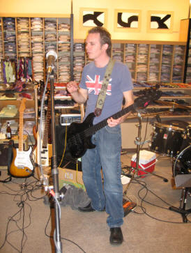 John Kirsch 12-15-06 at Neiman Marcus posing with John Taylor signature J84 peavey bass